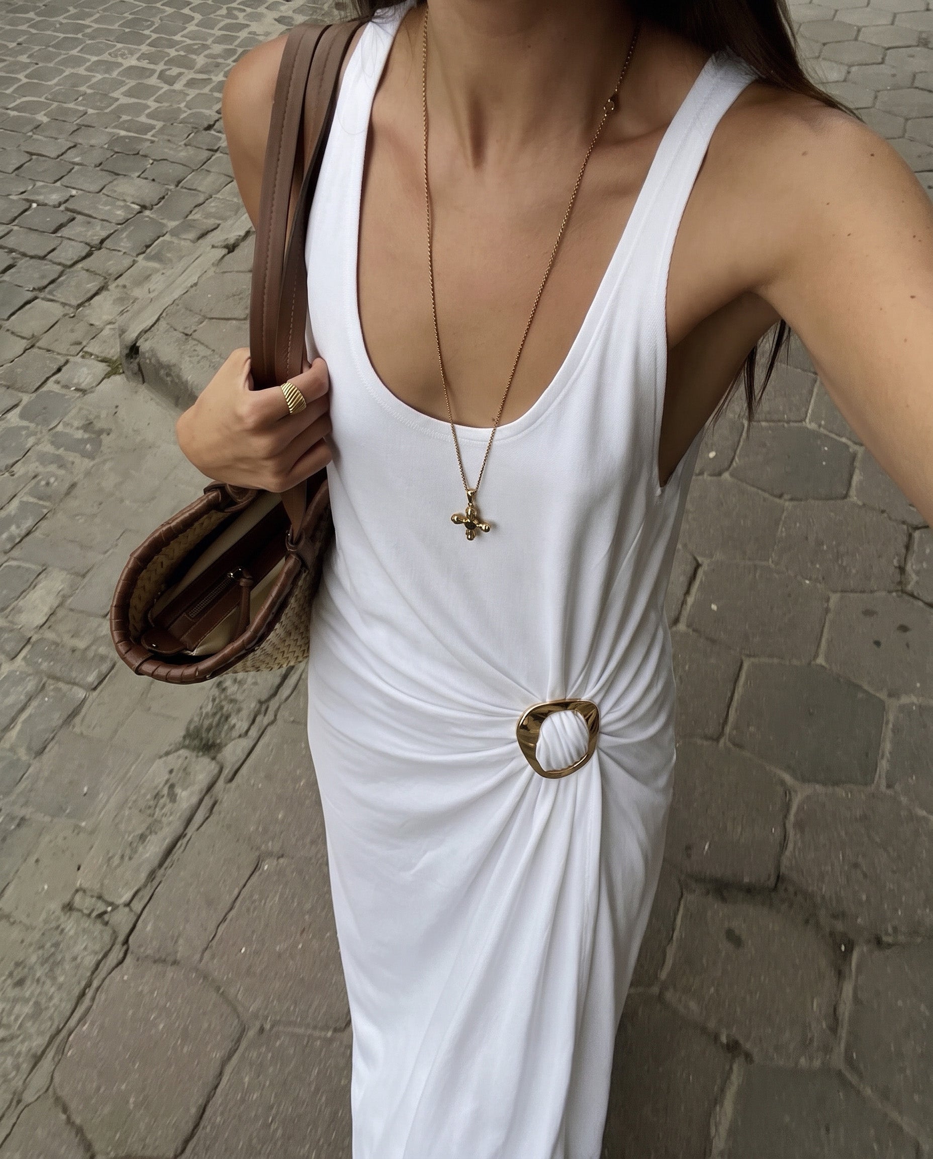 Woman in a white maxi dress adorned with a MagniClip Glossy Glow by Kitdo at the waist.