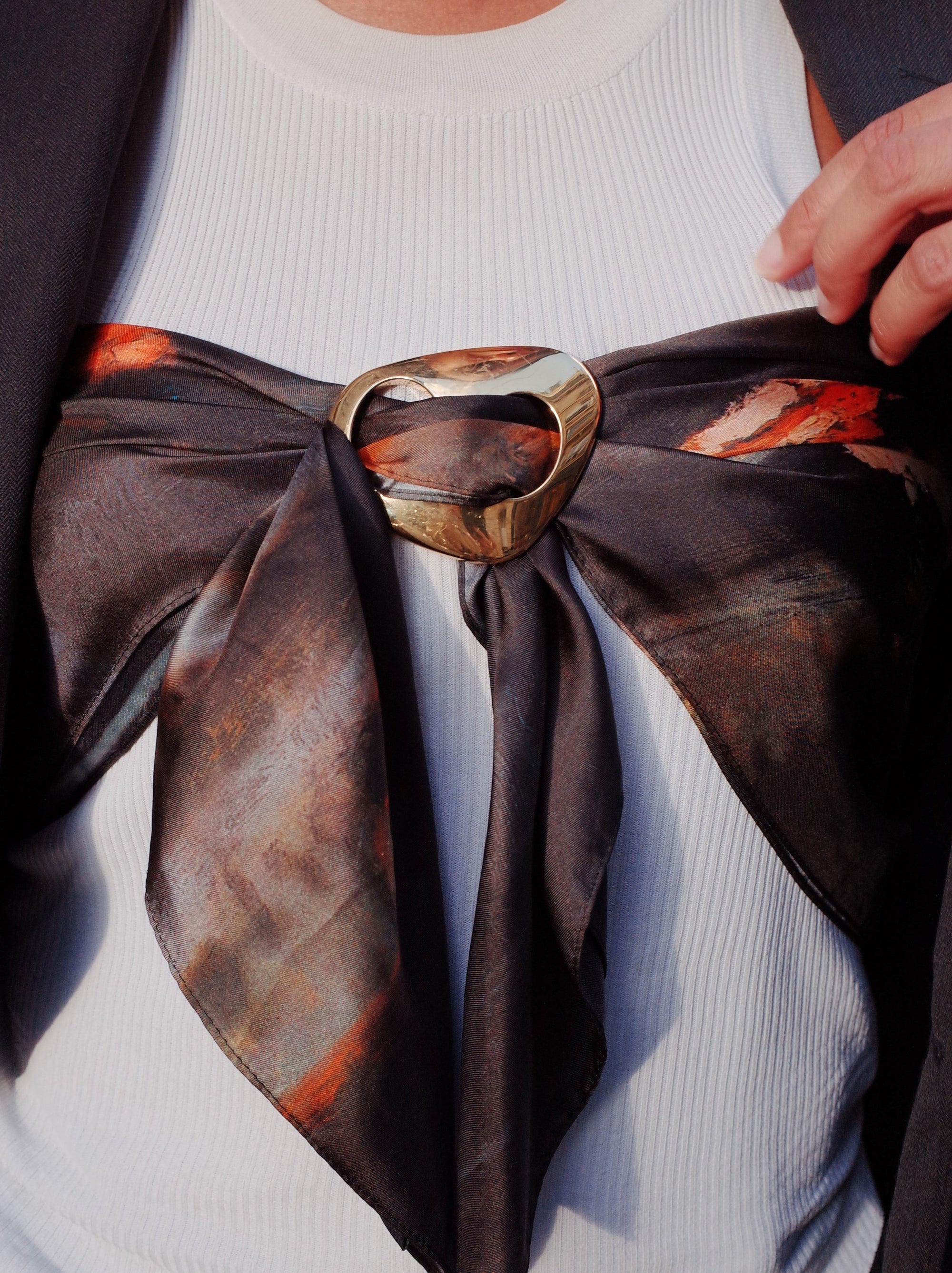Scarf worn on the chest kept in place with Magnetic fabric clip 
